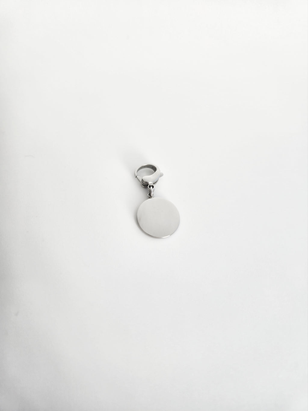 Charm rond avec étoile et strass en Acier Inoxydable