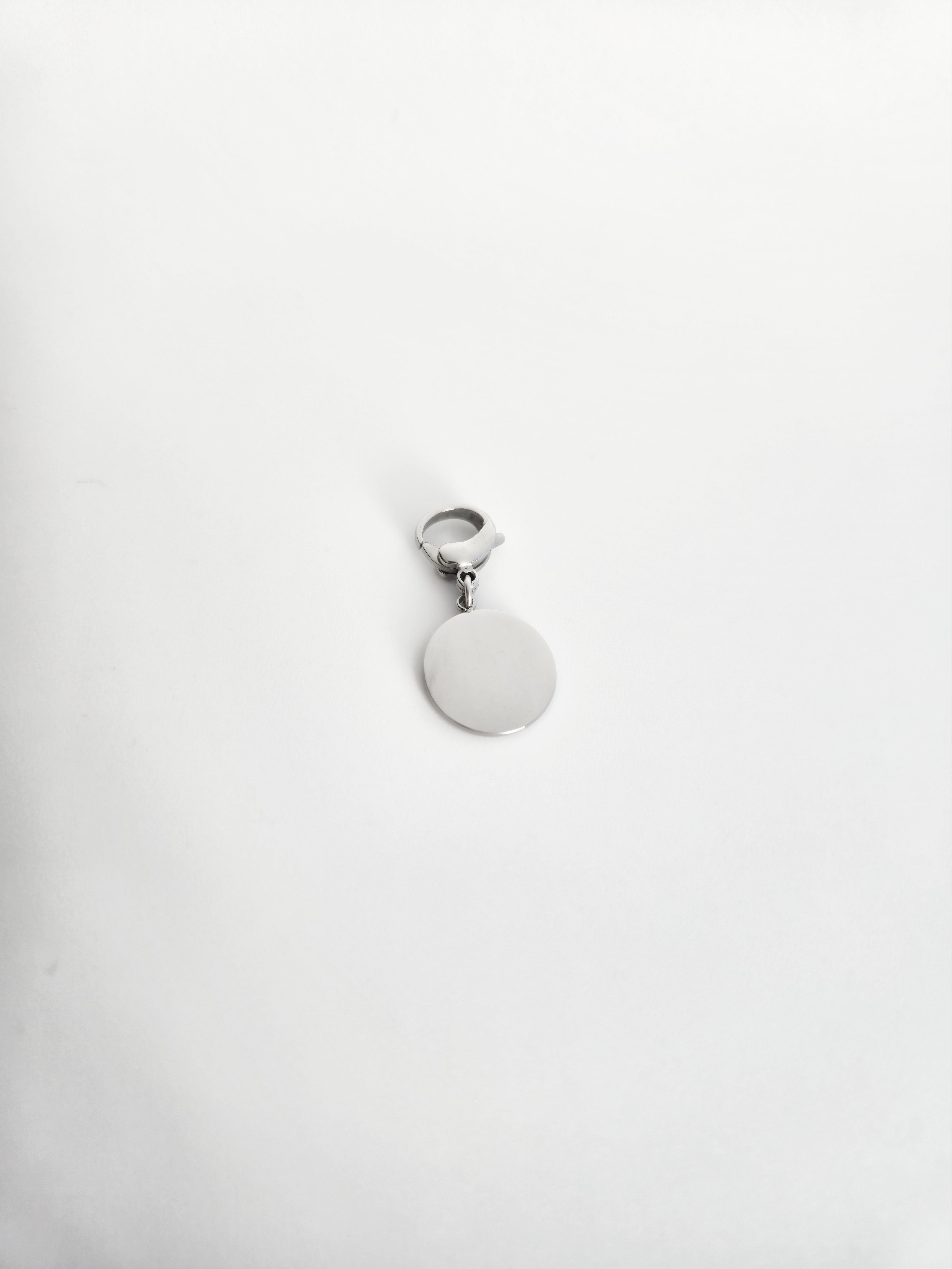 Charm rond avec étoile et strass en Acier Inoxydable